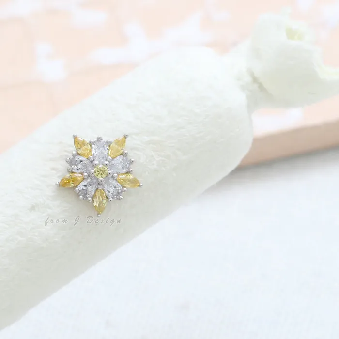Earrings from J Shop Yellow CZ Accent Star Flower Piercing