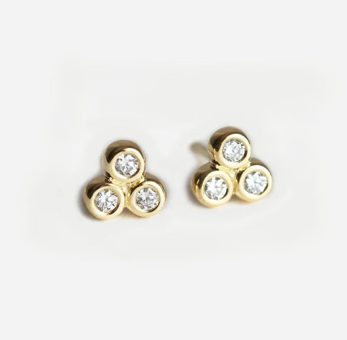Gold Stud Earrings With 3 Small Round Cut Diamonds Apiece Capucinne Earrings