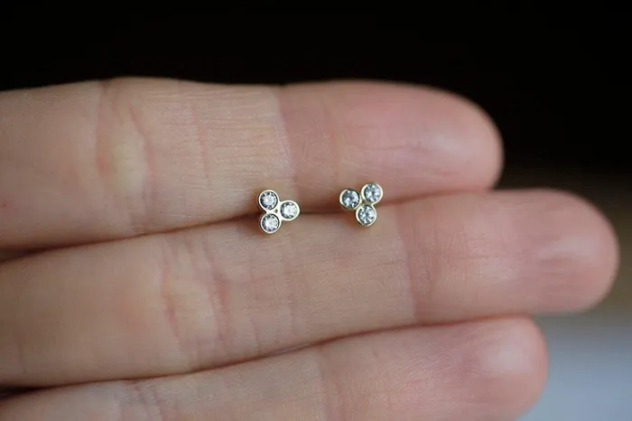 Gold Stud Earrings With 3 Small Round Cut Diamonds Apiece Capucinne Earrings